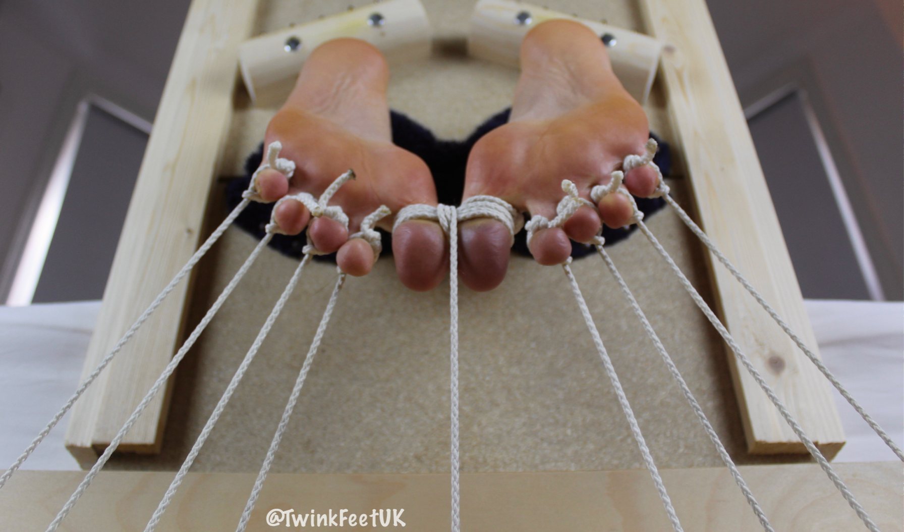 Tied twink feet in my stocks