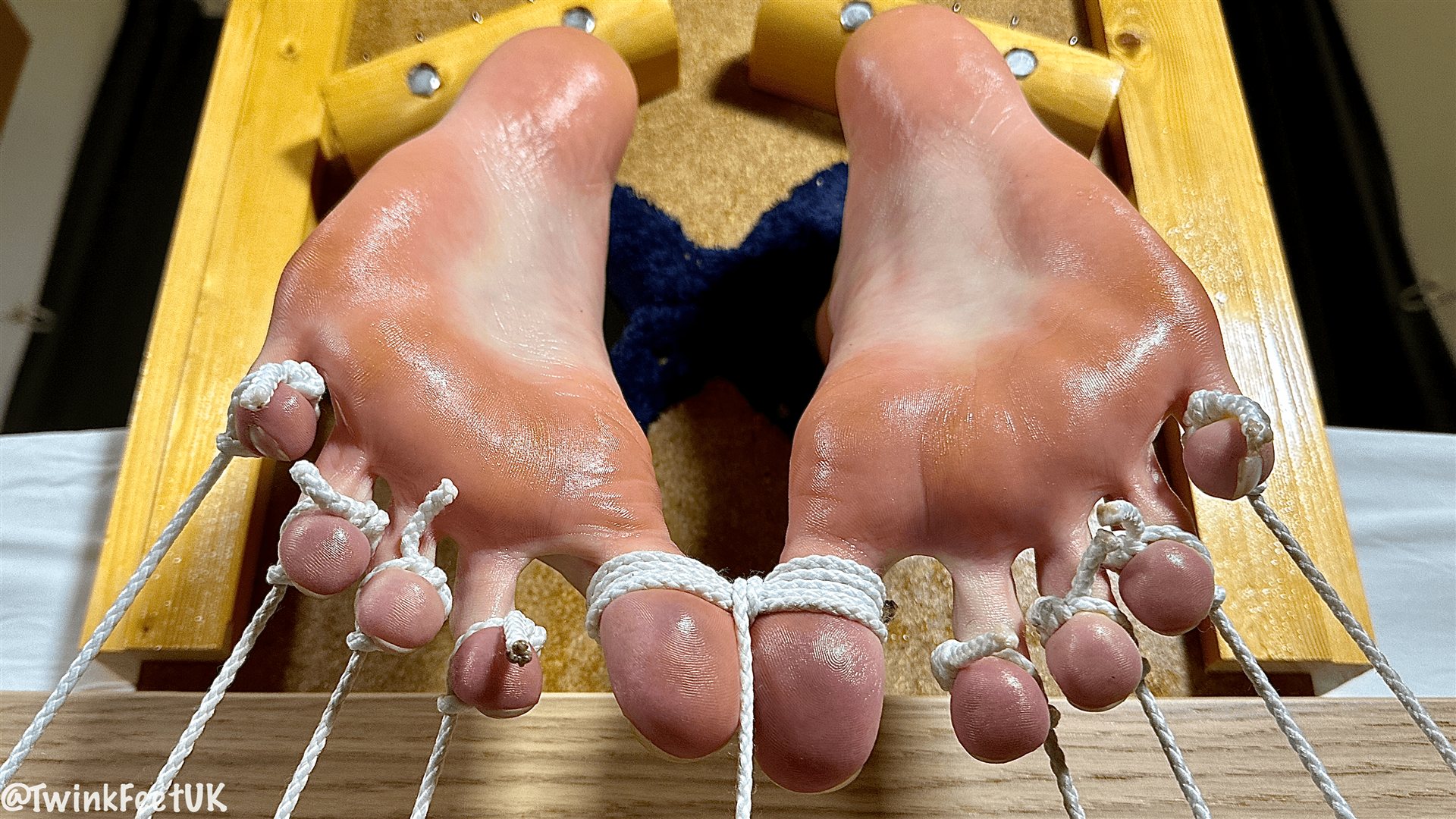 Photos of @DomJTwink with his toes tied down in my stocks