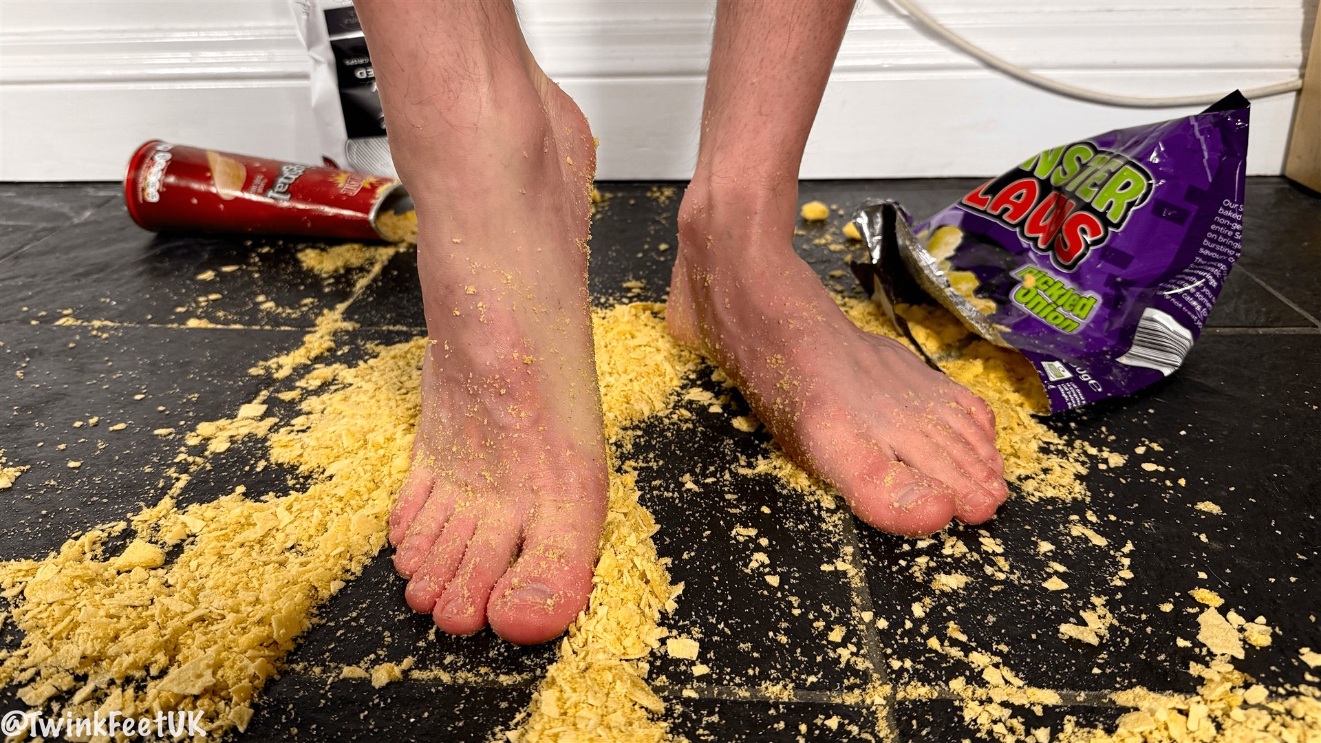 Photos of @KamTeases crushing crisps with his feet